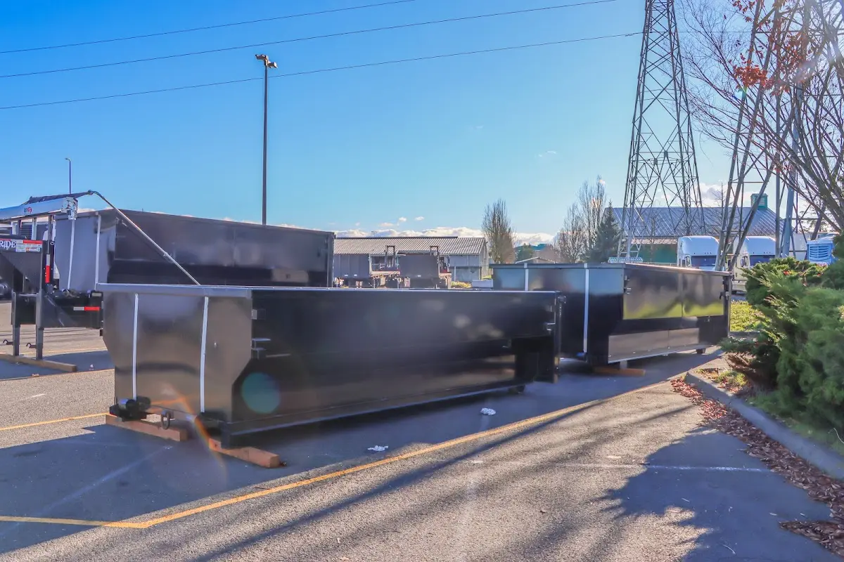 Roll-off dumpster ready for waste disposal at job site for 12 Yard Dumpster Rental in Central Point
